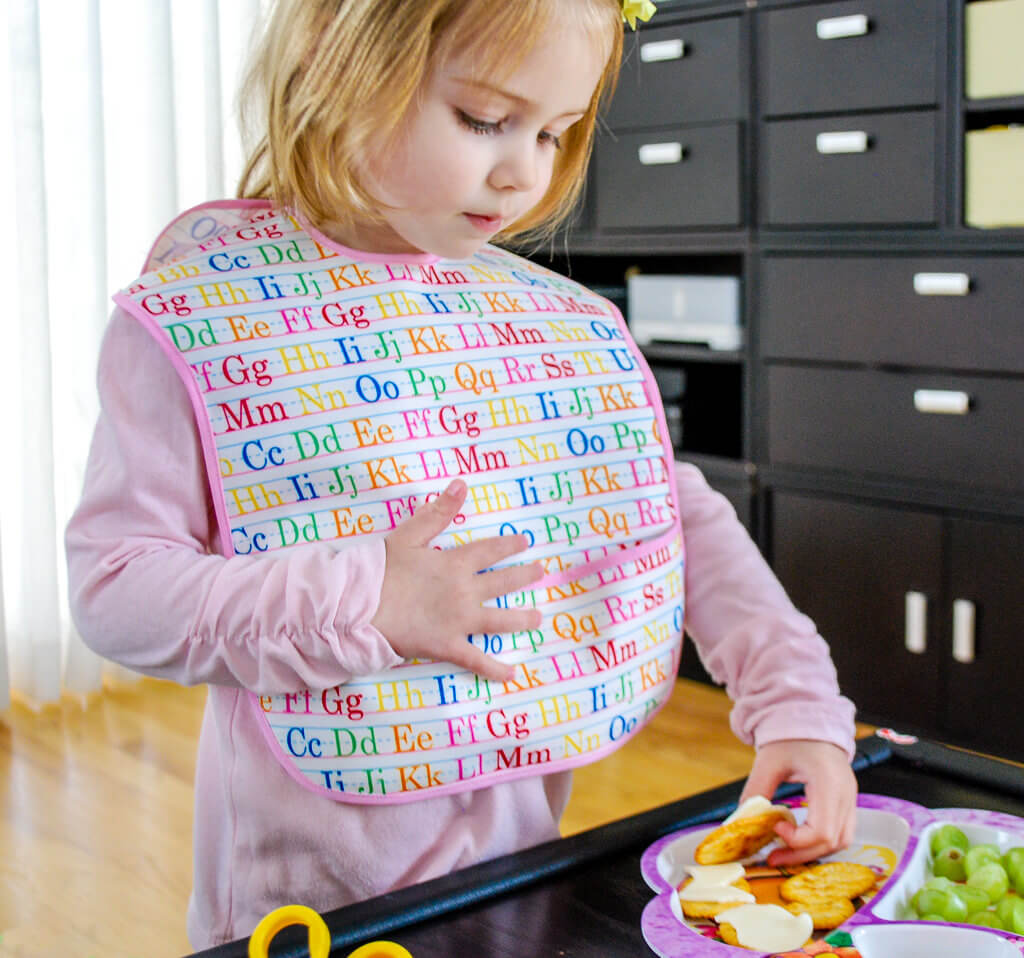 https://www.merrimentdesign.com/extra-long-baby-bib-free-sewing-pattern-for-toddler-sized-spills.php/toddler-bib-free-sewing-pattern_1