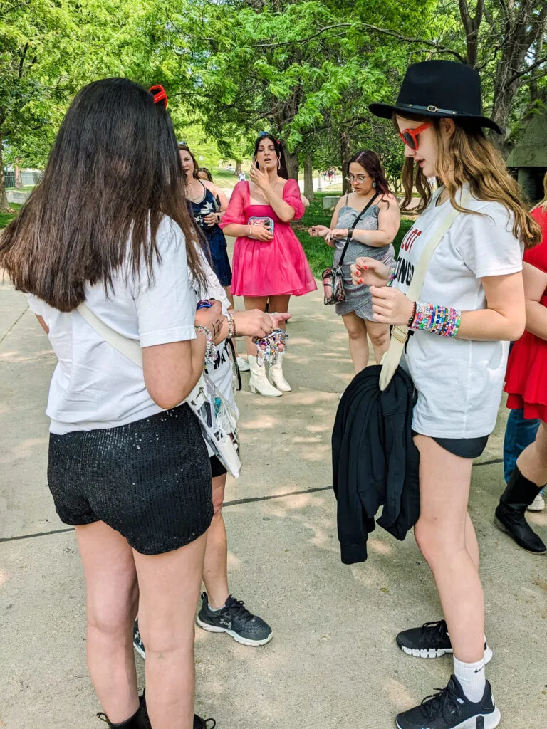 Trading bracelets at the Taylor Swift Concert at Soldier Field. Copyright 2023 Merriment Design Co. Please contact me for written permission before sharing this photo.