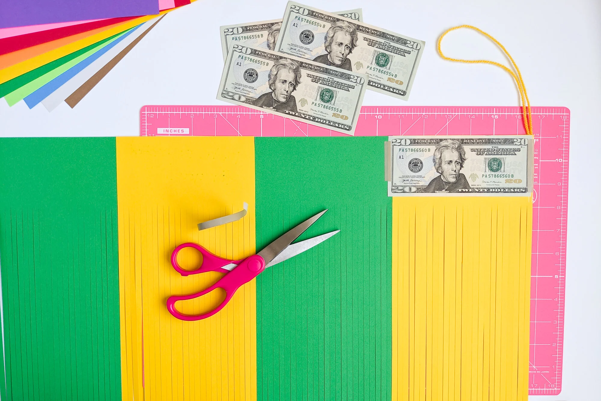 How to temporarily tape a money gift inside DIY paper graduation tassels