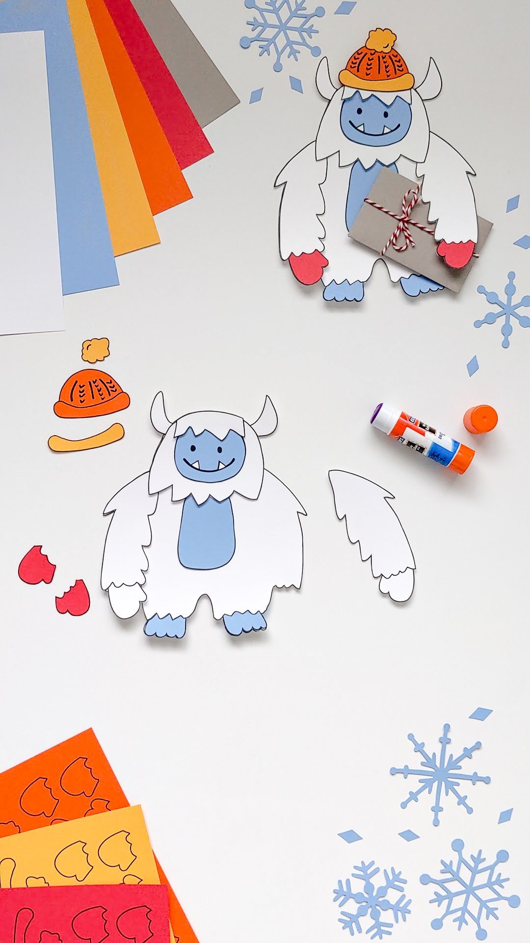 Gluing together a paper Yeti Abominable Snowman craft using a glue stick