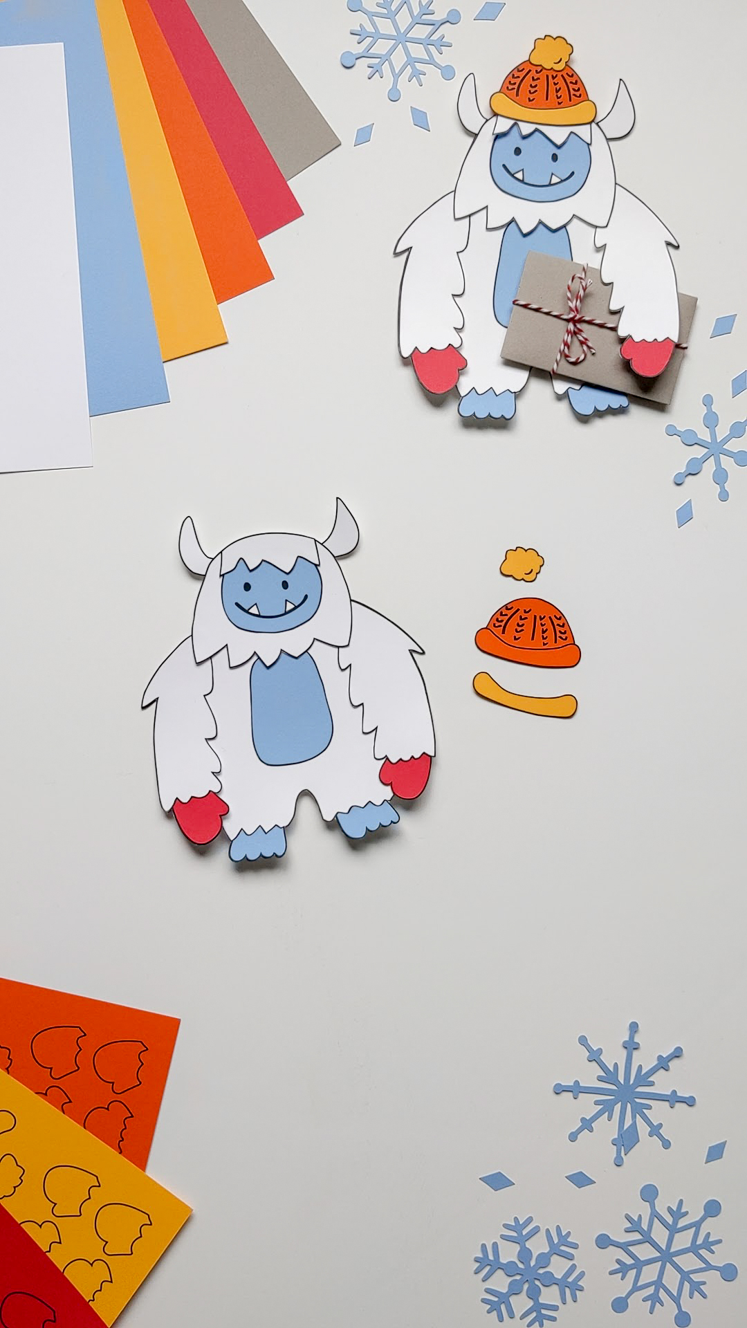 Gluing together a paper Yeti Abominable Snowman craft using a glue stick